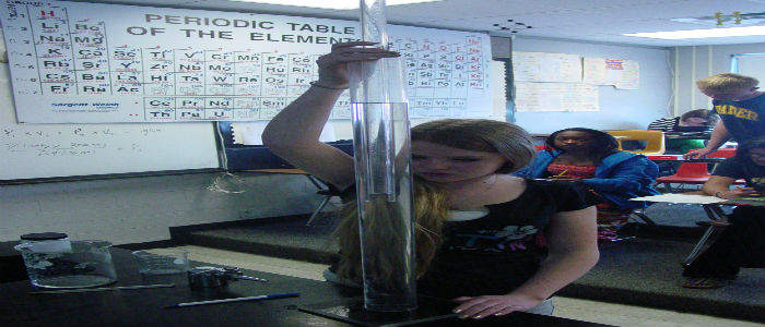 Taylor Kaelin records data from the volume change.